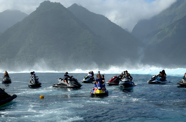 Members of the World Surf League support team gather on jetskis in Teahupo’o, Tahiti on May 30, 2024. (Photo by Thomas Bevilacqua/Reuters)