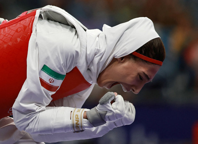 Iran's Mobina Nematzadeh celebrates beating Saudi Arabia's Dunya Ali M Abutaleb in the taekwondo women's -49kg bronze medal bout of the Paris 2024 Olympic Games at the Grand Palais in Paris on August 7, 2024. (Photo by Tingshu Wang/Reuters)