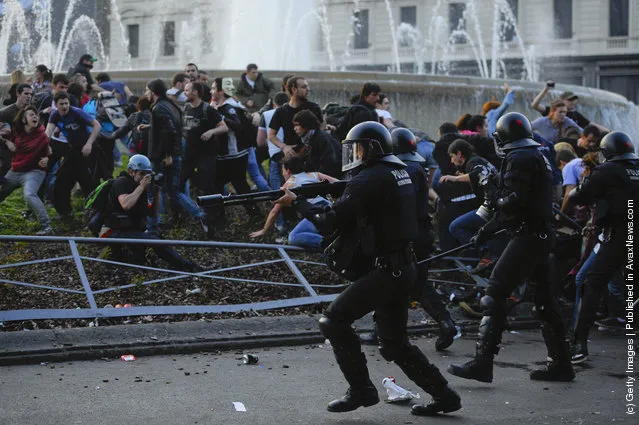 Riot police clash with demonstrators during heavy clashes with demonstrators during a 24-hour strike on March 29, 2012 in Barcelona, Spain