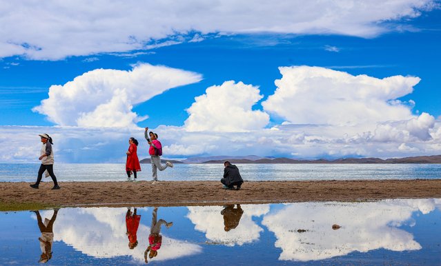 Tourists visit Lake Namtso scenic area on September 8, 2024 in Lhasa, Xizang Autonomous Region of China. (Photo by VCG/VCG via Getty Images)