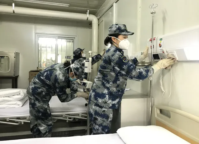 Medical staff test facilities and make the bed at Huoshenshan (Fire God Mountain) Hospital to make final preparations to admit patients infected with the novel coronavirus in central China's Hubei Province on February 3, 2020. (Photo by Chine Nouvelle/SIPA Press/Rex Features/Shutterstock)