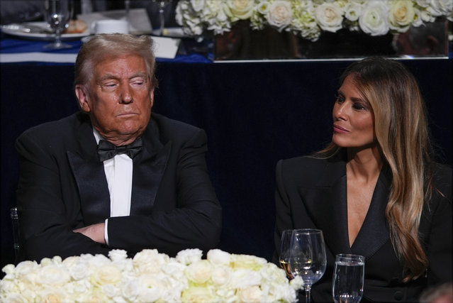 Republican presidential nominee former President Donald Trump and former first lady Melania Trump listen druing the 79th annual Alfred E. Smith Memorial Foundation Dinner, Thursday, October 17, 2024, in New York. (Photo by Julia Demaree Nikhinson/AP Photo)