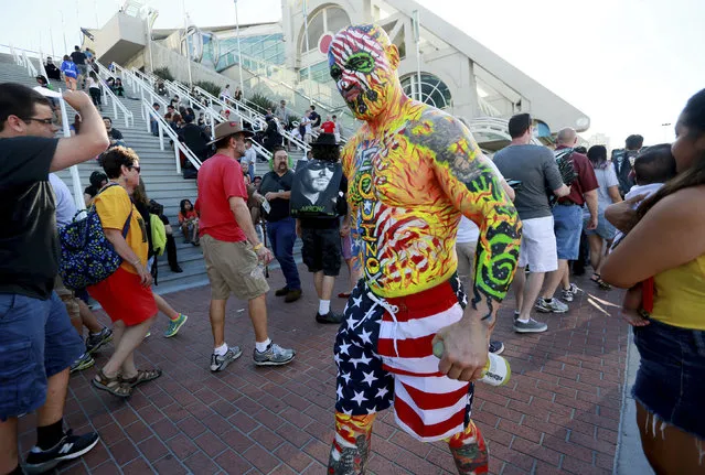 A costumed man who gave his name as Nomad walks outside of the San Diego Convention Center during the 2014 Comic-Con International Convention in San Diego, California July 23, 2014. (Photo by Sandy Huffaker/Reuters)