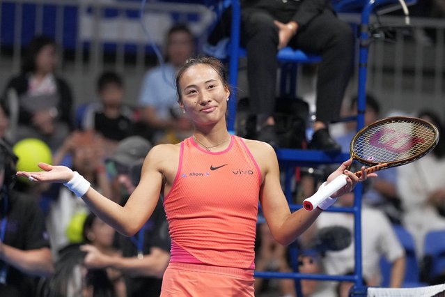 China's Zheng Qinwen gestures after winning against Sofia Kenin of the United States in the final match of the Pan Pacific Open women's tennis tournament at Ariake Coliseum, in Tokyo, Sunday, October 27, 2024. (Photo by Eugene Hoshiko/AP Photo)