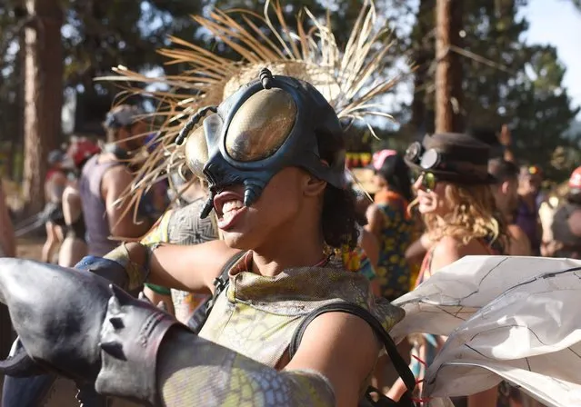 People attend the Oregon Eclipse Festival, August 20, 2017, at Big Summit Prairie ranch in Oregon' s Ochoco National Forest near the city of Mitchell ahead of the total solar eclipse on August 21, 2017. (Photo by Robyn Beck/AFP Photo)