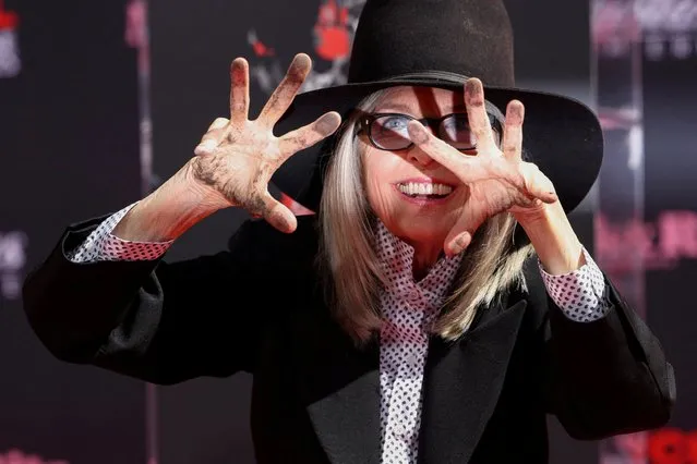 Actor Diane Keaton shows her hands after placing them on fresh cement during a ceremony TCL Chinese theatre in Los Angeles, California, U.S., August 11, 2022. (Photo by Mario Anzuoni/Reuters)