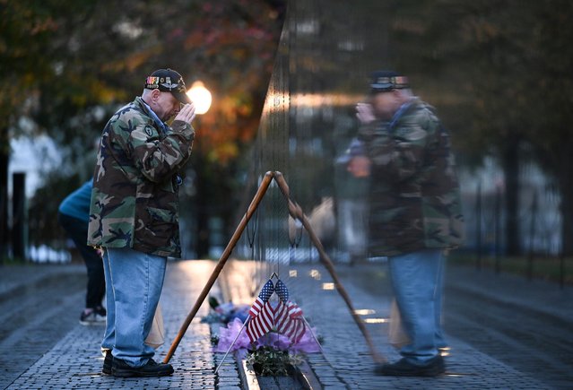 Bernie Klemanek, of Mineral, Va., salutes after placing a flag at the Vietnam Veterans Memorial on Veterans Day in Washington on November 11, 2024. (Photo by Matt McClain/The Washington Post)