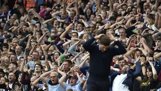 Fans react during the English Premier League soccer match between Aston Villa and Manchester City at Villa Park in Birmingham, England, Saturday, September 3, 2022. (Photo by Rui Vieira/AP Photo)
