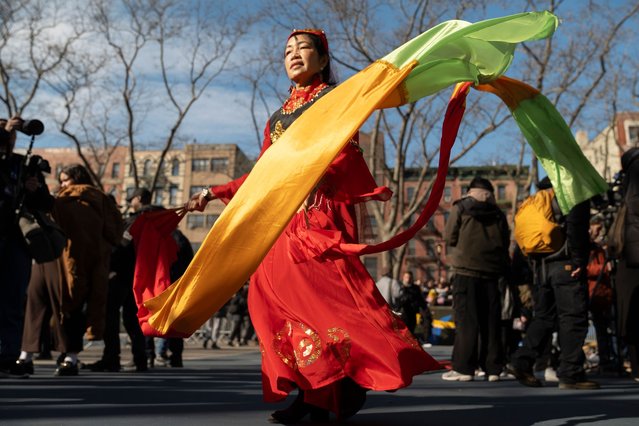 Volunteers and spectators gather at Sara D. Roosevelt park in Manhattan's Chinatown during a firecracker celebration for Lunar New Year, Wednesday, January 29, 2025, in New York. This year marks the Year of the Snake. (Photo by John Minchillo/AP Photo)