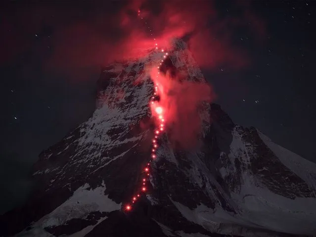 Climbers “painted” the Matterhorn red this week to celebrate a special anniversary. A group of mountaineers left red beacons along the route of the famous climb, which is one of the highest mountains in the Alps, and as nightfall came the imposing mountain came alive with colour. The event was organised by clothing brand Mammut to celebrate the 150th anniversary of the first explorers to scale the mountain. (Photo by MSN UK/Mammut)
