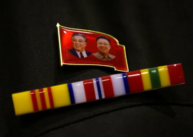 A North Korea fan wears a pin of North Korea founder Kim Il Sung and late leader Kim Jong Il during a North Korea fan event in Tokyo, Japan on November 2, 2017. (Photo by Toru Hanai/Reuters)
