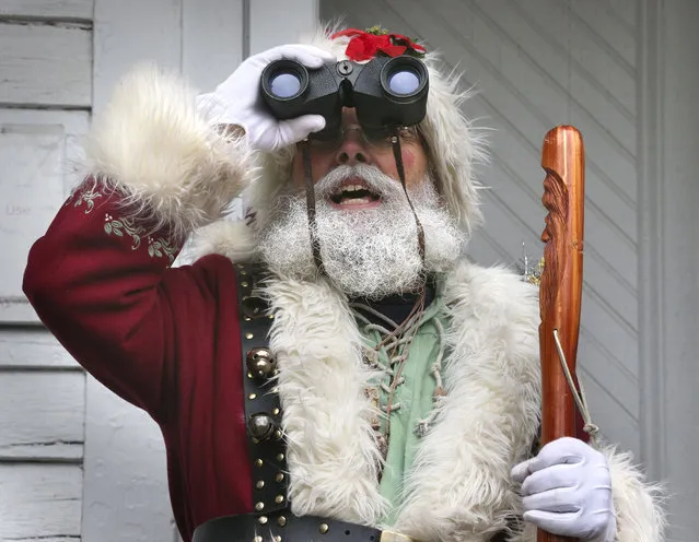 Tom Ford of Luray, Va., dressed as Santa, takes part in the annual Bird Count and Family Festival at the State Arboretum of Virginia at Blandy Experimental Farm in Boyce, Va. Sunday, December 17, 2017. (Photo by Jeff Taylor/The Winchester Star via AP Photo)