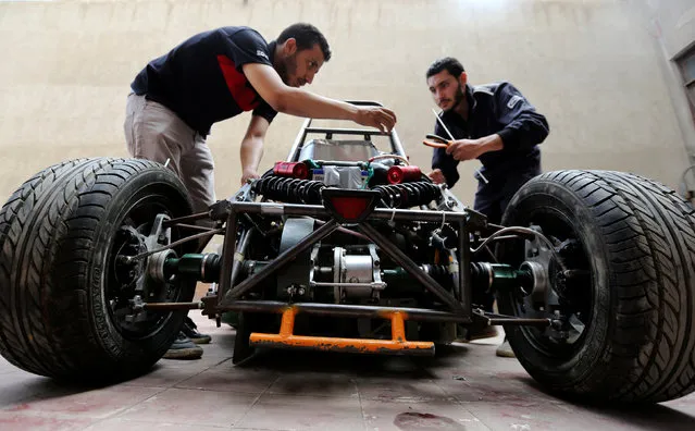 Egyptian university students work on a racing car they built to compete at the Formula Student UK in Cairo, Egypt September 2, 2016. (Photo by Mohamed Abd El Ghany/Reuters)