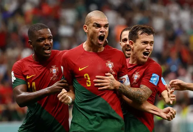 Pepe #3 of Portugal celebrates after scoring his team's second goal during the FIFA World Cup Qatar 2022 Round of 16 match between Portugal and Switzerland at Lusail Stadium on December 6, 2022 in Lusail City, Qatar. (Photo by Kai Pfaffenbach/Reuters)