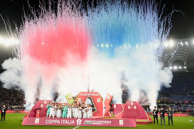 Bologna's team players celebrate with the trophy after the Italian Cup final soccer match between AC Milan and Bologna at Rome's Olympic Stadium, Wednesday, May 14, 2025. (Photo by Gregorio Borgia/AP Photo)