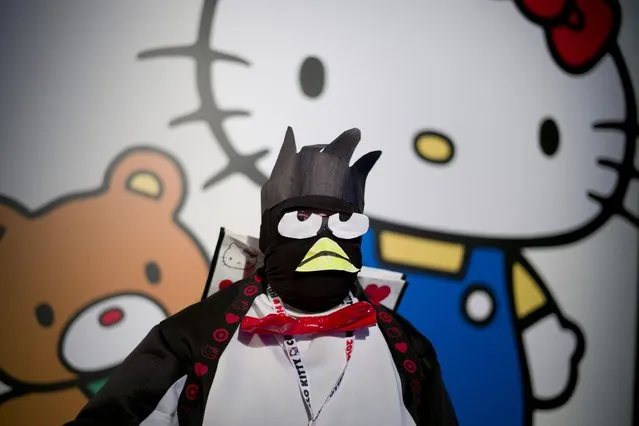 A man dresses as Bad Badtz-Maru, one of the Sanrio characters, pauses for photos at the Hello Kitty Con, the first ever Hello Kitty fan convention, held at the Geffen Contemporary at MOCA Thursday, October 30, 2014, in Los Angeles. (Photo by Jae C. Hong/AP Photo)