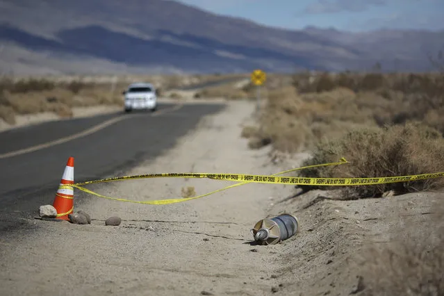 A piece of wreckage from the crash of Virgin Galactic's SpaceShipTwo lies by a road near Cantil, California, on November 2, 2014. (Photo by David McNew/Reuters)