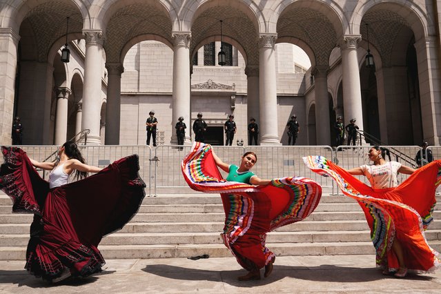 People dance as they protest against federal immigration sweeps, in downtown Los Angeles, California, U.S., June 11, 2025. (Photo by David Ryder/Reuters)
