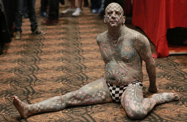 Matt Gone, known as “Checkered Man”, poses for a photo at a during the VIII International Tattoo Artist Convention in Bogota, Colombia, Saturday, November 15, 2014. (Photo by Fernando Vergara/AP Photo)