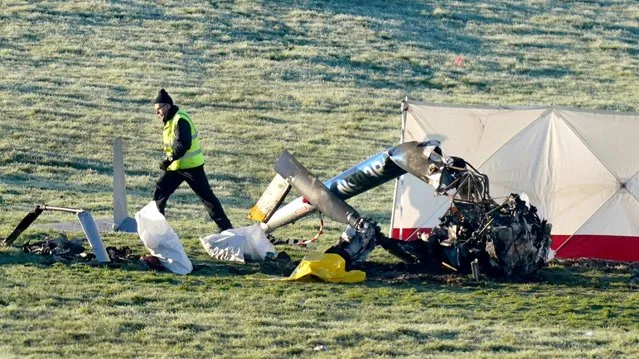 Accident investigators at the scene of a helicopter crash near Kilcullen in Co Kildare, Ireland on Monday, December 12, 2022. The helicopter crashed into a field in Brannockstown about 5kms southeast of Kilcullen on Sunday evening. (Photo by Niall Carson/PA Images via Getty Images)
