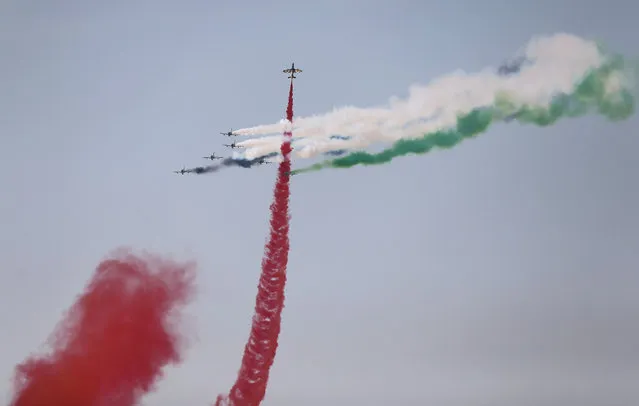 Al Fursan, the UAE Air Force aerobatic display team, perform during the opening of the Dubai Airshow in United Arab Emirates, Sunday, November 8, 2015. (Photo by Kamran Jebreili/AP Photo)