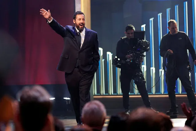 Actor and comedian Adam Sandler waves as he is awarded the Mark Twain Prize for American Humor at the Kennedy Center in Washington, U.S., March 19, 2023. (Photo by Joshua Roberts/Reuters)