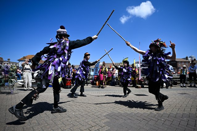 Anonymous Morris dancers, from Poole, perform for the public at the Wessex Folk Festival, on June 02, 2024 in Weymouth, United Kingdom. The Wessex Folk Festival has been established for the past 20 years. It is one of the biggest free festivals in the UK, held on the picturesque Harbourside in Weymouth. (Photo by Finnbarr Webster/Getty Images)