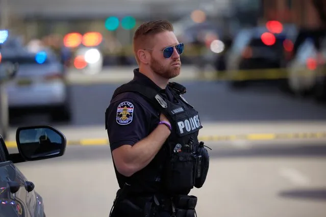 A police officer stands by at an active shooter incident near the Old National Bank building on April 10, 2023 in Louisville, Kentucky. According to initial reports, there are multiple casualties but the shooter is no longer a threat. (Photo by Luke Sharrett/Getty Images)