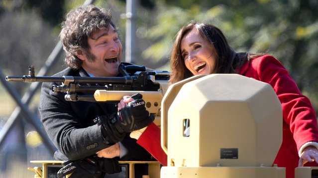 Argentine President Javier Milei, left, and his Vice President Victoria Villarruel stand on an armored tank during a military parade celebrating Independence Day in Buenos Aires, Argentina, Tuesday, July 9, 2024. (Photo by Gustavo Garello/AP Photo)