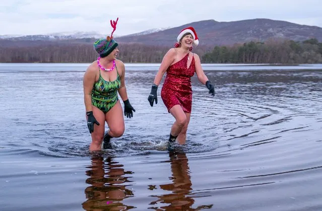 Members of the Loch Insh Dippers wild swim group take part in a Christmas-themed swim in Loch Insh in the Cairngorms National Park near Aviemore, Scotland on Friday, December 23, 2022. (Photo by Jane Barlow/PA Images via Getty Images)