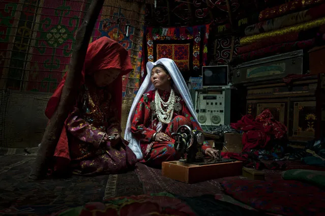 “First Place Winner: Butterfly”. This image was shot in the Kyrgyz lands of the Wakhan Corridor. The intimacy of this everyday life moment, shot inside of a family yurt, is in total contrast with the harsh environment these nomadic tribes live in. On the right we notice a television and a sound console. (Photo and caption by Cedric Houin/National Geographic Traveler Photo Contest)
