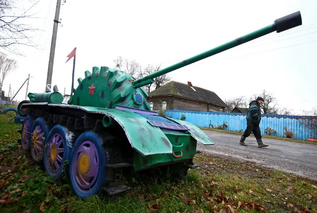 An installation with a copy of a tank is seen at a villager's house in the village of Vits, Belarus November 8, 2016. (Photo by Vasily Fedosenko/Reuters)
