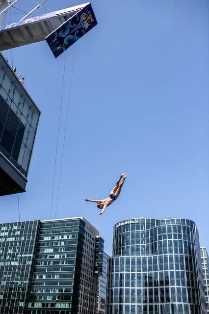 In this handout image provided by Red Bull, Eleanor Smart of the USA dives from the 21 metre platform on the Institute of Contemporary Art during the first training session of the first stop of the Red Bull Cliff Diving World Series on June 01, 2023 at Boston, USA. (Photo by Dean Treml/Red Bull via Getty Images)