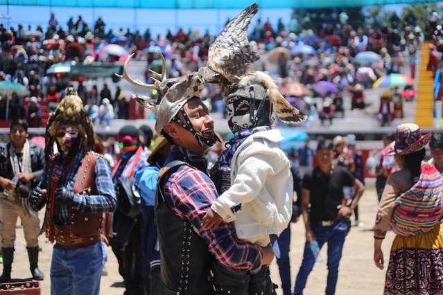 Peruvian people, wearing colorful mask participate in Takanakuy celebrations in the region of Chumbivilcas, Cusco in the Andes of southern Peru on December 25, 2024. The Takanakuy is a traditional celebration held every December 25. The celebration can last many days. The word “Takanakuy” means “to strike with the fist” and fighters are heating with dances and songs called Wayliyas. Men and women who have had problems with other people during the year are fixing their conflicts at the end of the year with one or several fights. Usually, conflicts are raised by issues related to land or harvesting, stealing animals or insulting the name of the father. Some collisions are caused by love or friendship issues. (Photo by Jorge Cerdan/Anadolu via Getty Images)