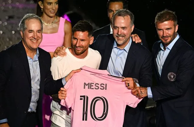 Argentine soccer star Lionel Messi (2nd L) is presented by (from R) owners of Inter Miami CF David Beckham, Jose R. Mas and Jorge Mas as the newest player for Major League Soccer's Inter Miami CF, at DRV PNK Stadium in Fort Lauderdale, Florida, on July 16, 2023. (Photo by Chandan Khanna/AFP Photo)