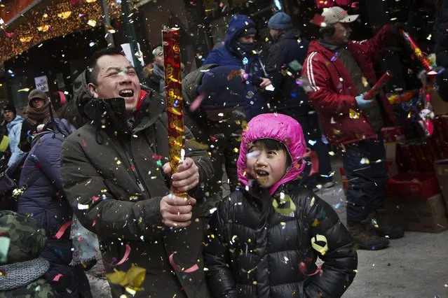 People celebrate Chinese Lunar New Year in New York's China Town February 19, 2015. (Photo by Brendan McDermid/Reuters)