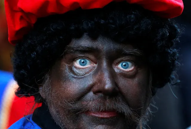 An assistant of Saint Nicholas called “Zwarte Piet” (Black Pete) takes part in a traditional parade in central Brussels, Belgium December 3, 2016. (Photo by Yves Herman/Reuters)