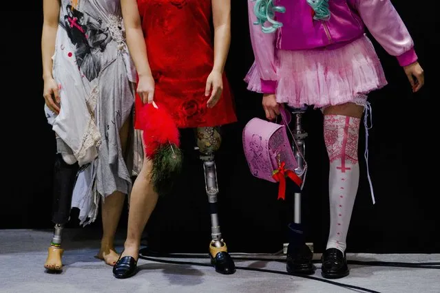 Women wearing prosthetic legs participate in a public photo session at the Hasselblad and Profoto booth, during the CP+ camera and imaging equipment trade fair in Yokohama south of Tokyo, February 14, 2015. (Photo by Thomas Peter/Reuters)