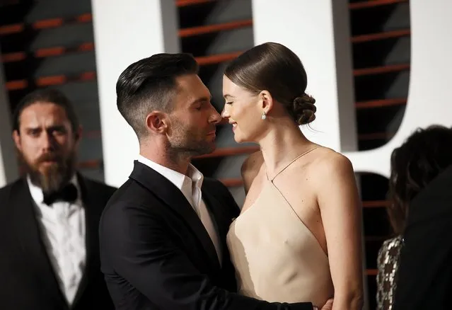 Musician Adam Levine and wife, model Behati Prinsloo, arrive at the 2015 Vanity Fair Oscar Party in Beverly Hills, California February 22, 2015. (Photo by Danny Moloshok/Reuters)
