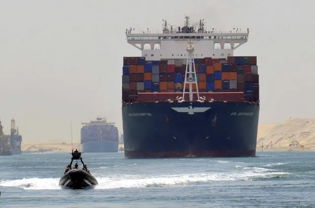 A cargo ship is seen crossing through the New Suez Canal, Ismailia, Egypt, July 25, 2015. (Photo by Reuters/Stringer)