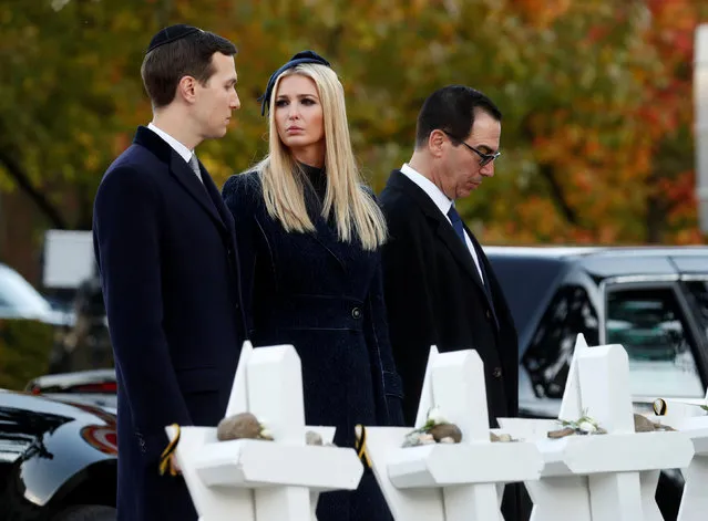 White House senior advisors Jared Kushner (L) and his wife Ivanka Trump stand with U.S. Treasury Secretary Steven Mnuchin at a makeshift memorial to the victims outside the Tree of Life Synagogue where a gunman killed eleven people and wounded six during a mass shooting in Pittsburgh, Pennsylvania, U.S., October 30, 2018. (Photo by Kevin Lamarque/Reuters)