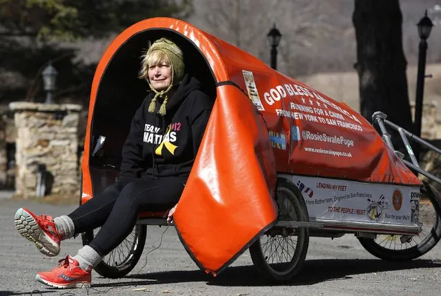 Sixty-eight year old cross-country runner Rosie Swale-Pope is interviewed while sitting in her cart, “The Icebird”, in Upperville, Virginia March 13, 2015. (Photo by Gary Cameron/Reuters)