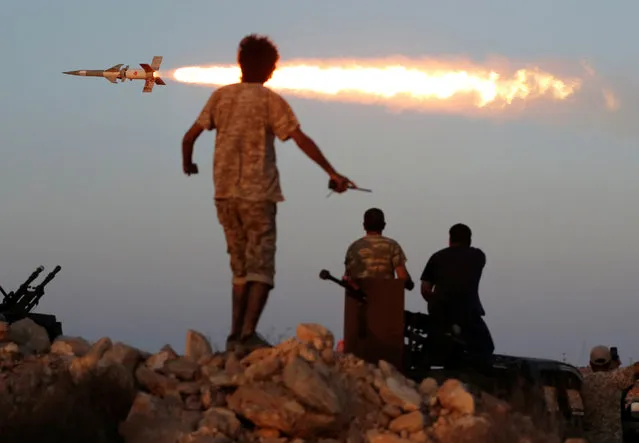 Fighters of Libyan forces allied with the U.N.-backed government fire a rocket at Islamic State fighters in Sirte, Libya, August 4, 2016. (Photo by Goran Tomasevic/Reuters)