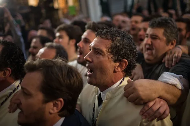 Antonio Banderas sings to Maria Santisima de Lagrimas y Favores trone with his mates prior to start its procession at San Juan Bautista church during Holy Week celebrations on March 29, 2015 in Malaga, Spain.  (Photo by Gonzalo Arroyo Moreno/Getty Images)