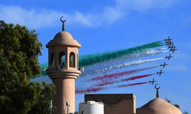 Italian Air Force aerobatic team performs in Kuwait City on November 18, 2018, as part of the celebration of the Italian week in Kuwait. (Photo by Giuseppe Cacace/AFP Photo)