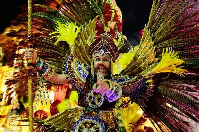 A performer from Estacio de Sa samba school points directly at the camera as he parades on a float during the Carnival celebrations at the Sambadrome in Rio de Janeiro, Brazil, Sunday, February 7, 2016. (Photo by Leo Correa/AP Photo)