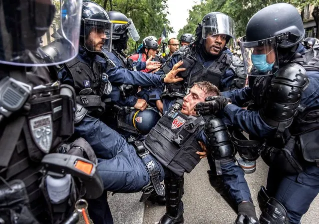 One member of the police force was seriously injured during clashes with demonstrators in Paris, France on July 31, 2021. Several thousand people gathered to demonstrate against the health pass. (Photo by Sadak Souici/Le Pictorium Agency via ZUMA Press/Rex Features/Shutterstock)
