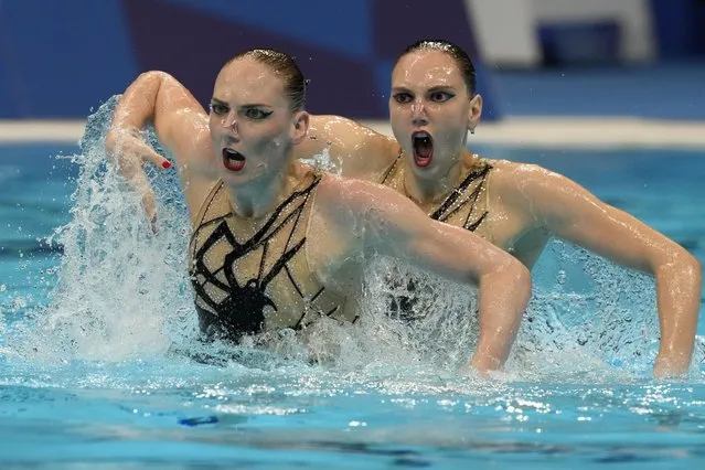 Svetlana Kolesnichenko and Svetlana Romashina of Russian Olympic Committee compete in the Duet Free Routine Preliminary at the Tokyo Aquatics Centre at the 2020 Summer Olympics, Monday, August 2, 2021, in Tokyo, Japan. (Photo by Dmitri Lovetsky/AP Photo)