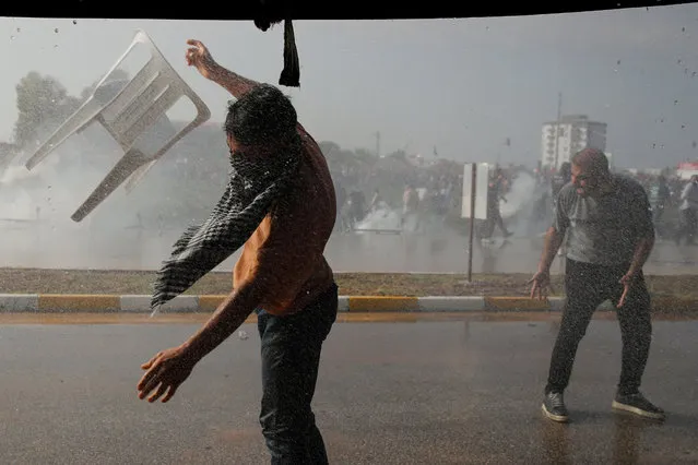Turkish police use water cannons and tear gas to disperse Pro-Palestinian demonstrators during a protest against the U.S. and Israel near the Incirlik Air Base, which is housing U.S. troops, in Adana, southern Turkey on November 5, 2023. (Photo by Dilara Senkaya/Reuters)