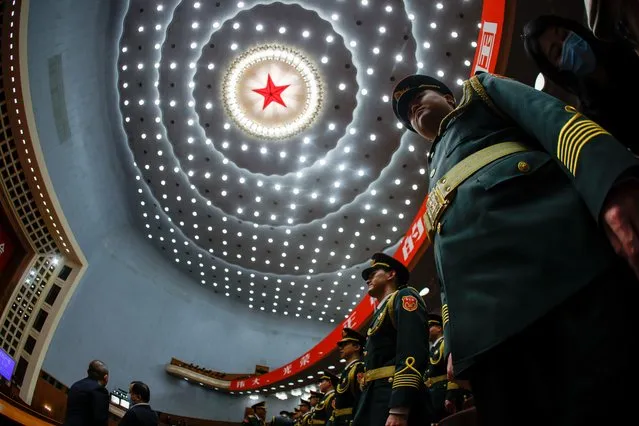 Military band membesr stand at attention during the opening ceremony of the 20th National Congress of the Communist Party of China at the Great Hall of People in Beijing, China, 16 October 2022. The 20th National Congress of the Communist Party of China opens on 16 October where Chinese President Xi Jinping is expected to be granted a third five-year term. (Photo by Mark R. Cristino/EPA/EFE)